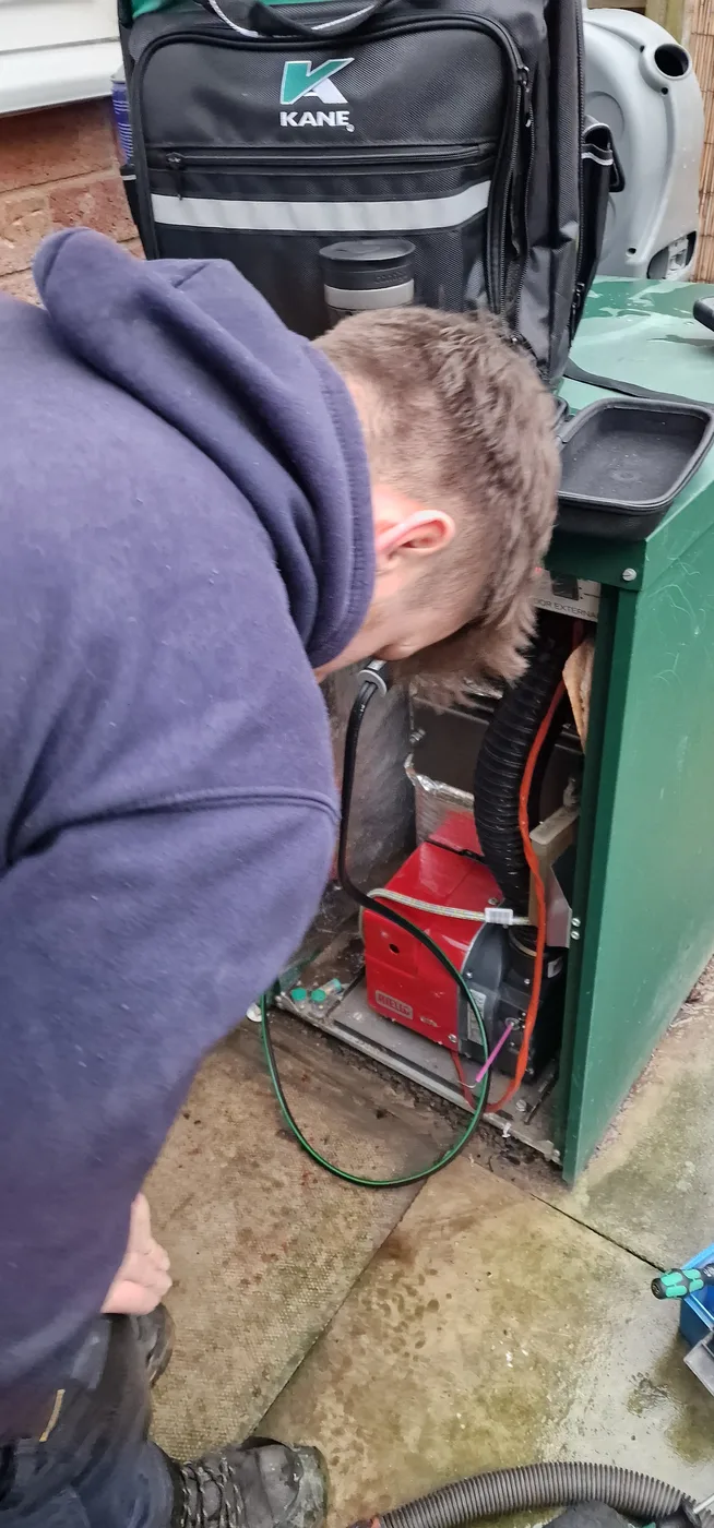 PCR Plumbers engineer servicing an outdoor oil boiler in Riccall
