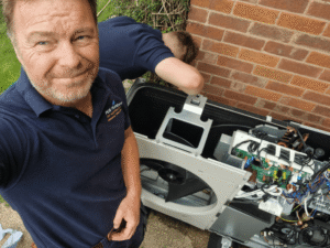 A PCR engineer servicing a heat pump in a home in Escrick